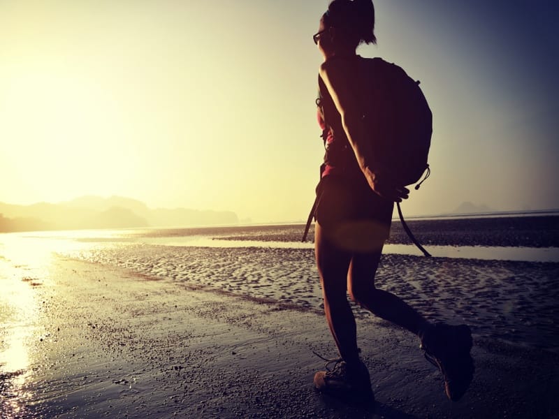 Woman touring the Palomino Beaches at sunset | Colombia Travel