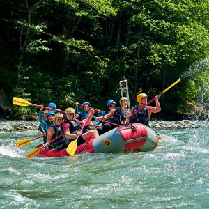 Rafting in the Amazon, a group of tourists raft on a crystal clear river